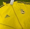 Picture of Real Madrid 2024 Double Sided Jacket Black & Red/Yellow